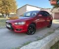 Червоний Міцубісі Lancer, об'ємом двигуна 2 л та пробігом 205 тис. км за 5600 $, фото 1 на Automoto.ua