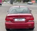 Червоний Міцубісі Lancer, об'ємом двигуна 1.58 л та пробігом 223 тис. км за 6400 $, фото 10 на Automoto.ua