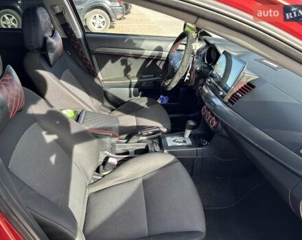 Красный Мицубиси Лансер, объемом двигателя 2 л и пробегом 227 тыс. км за 7000 $, фото 17 на Automoto.ua