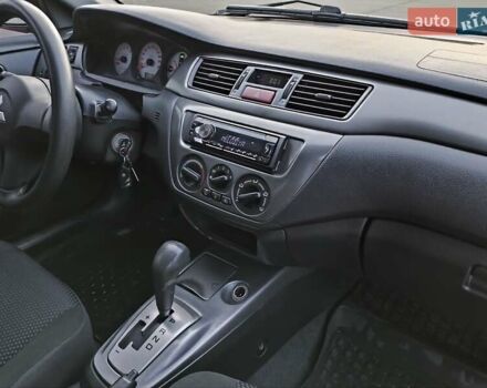Червоний Міцубісі Lancer, об'ємом двигуна 1.58 л та пробігом 140 тис. км за 6000 $, фото 33 на Automoto.ua