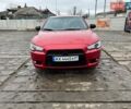 Красный Мицубиси Лансер, объемом двигателя 2 л и пробегом 299 тыс. км за 6500 $, фото 1 на Automoto.ua