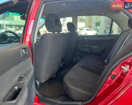 Червоний Міцубісі Lancer, об'ємом двигуна 1.58 л та пробігом 223 тис. км за 6400 $, фото 18 на Automoto.ua