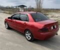 Красный Мицубиси Лансер, объемом двигателя 1.6 л и пробегом 330 тыс. км за 4600 $, фото 1 на Automoto.ua