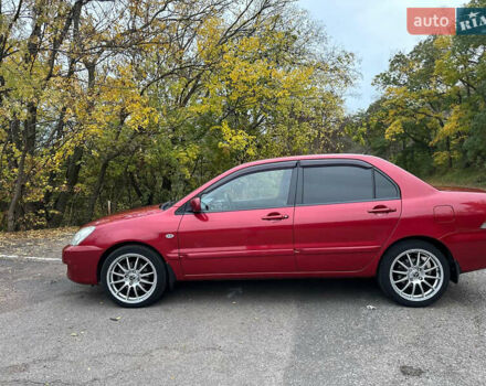 Красный Мицубиси Лансер, объемом двигателя 1.6 л и пробегом 192 тыс. км за 5999 $, фото 1 на Automoto.ua