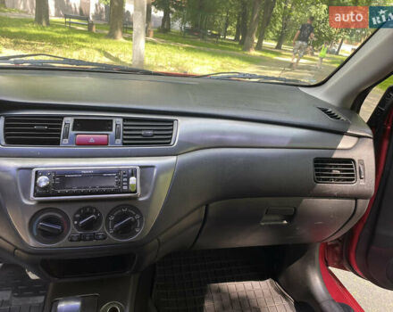 Червоний Міцубісі Lancer, об'ємом двигуна 1.6 л та пробігом 270 тис. км за 5699 $, фото 43 на Automoto.ua