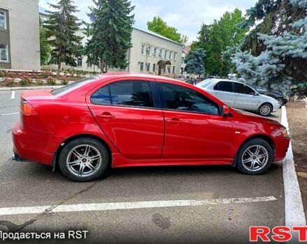 Червоний Міцубісі Lancer, об'ємом двигуна 2 л та пробігом 192 тис. км за 6000 $, фото 2 на Automoto.ua