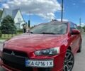 Красный Мицубиси Лансер, объемом двигателя 2 л и пробегом 212 тыс. км за 7200 $, фото 1 на Automoto.ua