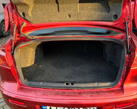 Красный Мицубиси Лансер, объемом двигателя 2 л и пробегом 143 тыс. км за 5200 $, фото 1 на Automoto.ua