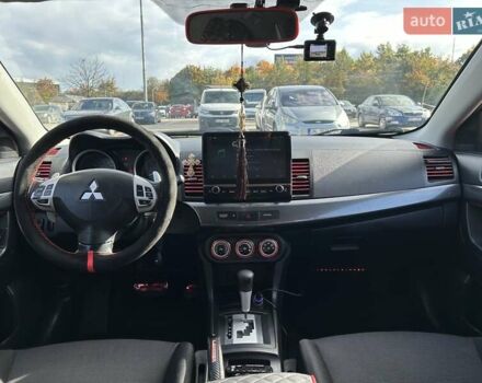 Красный Мицубиси Лансер, объемом двигателя 2 л и пробегом 227 тыс. км за 7000 $, фото 16 на Automoto.ua