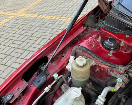 Красный Мицубиси Лансер, объемом двигателя 2 л и пробегом 143 тыс. км за 5200 $, фото 15 на Automoto.ua