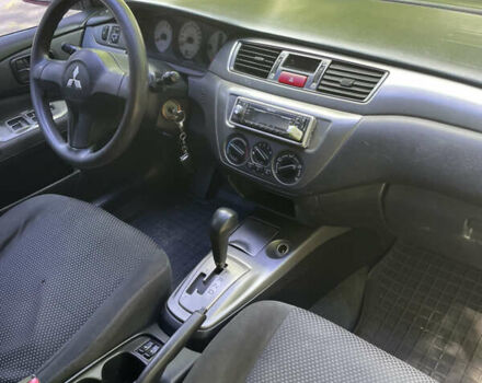 Червоний Міцубісі Lancer, об'ємом двигуна 1.6 л та пробігом 270 тис. км за 5699 $, фото 57 на Automoto.ua