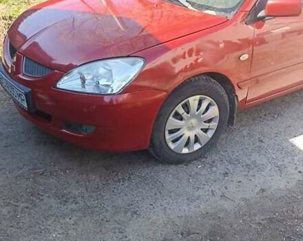 Мицубиси Лансер 2008 в Львове на Automoto.ua Красный Мицубиси Лансер, объемом двигателя 1.58 л и пробегом 280 тыс. км за 3200 $, фото 28 на Automoto.ua