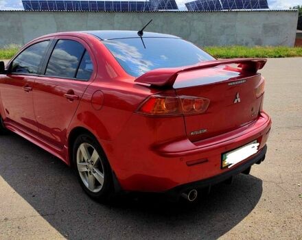 Красный Мицубиси Лансер, объемом двигателя 2 л и пробегом 300 тыс. км за 6200 $, фото 1 на Automoto.ua