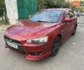 Червоний Міцубісі Lancer, об'ємом двигуна 2 л та пробігом 189 тис. км за 5200 $, фото 1 на Automoto.ua