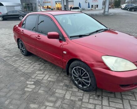 Красный Мицубиси Лансер, объемом двигателя 1.6 л и пробегом 265 тыс. км за 2956 $, фото 3 на Automoto.ua