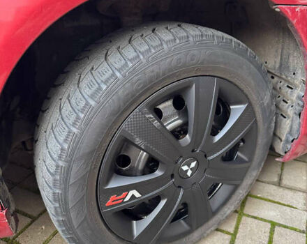 Красный Мицубиси Лансер, объемом двигателя 2 л и пробегом 143 тыс. км за 5200 $, фото 5 на Automoto.ua