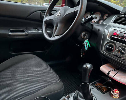 Красный Мицубиси Лансер, объемом двигателя 1.6 л и пробегом 192 тыс. км за 5999 $, фото 10 на Automoto.ua