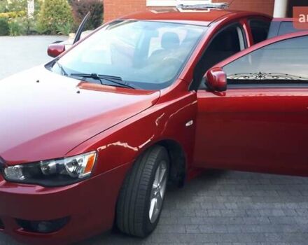 Червоний Міцубісі Lancer, об'ємом двигуна 2 л та пробігом 141 тис. км за 7600 $, фото 1 на Automoto.ua