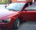 Червоний Міцубісі Lancer, об'ємом двигуна 2 л та пробігом 141 тис. км за 7600 $, фото 1 на Automoto.ua
