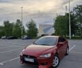 Красный Мицубиси Лансер, объемом двигателя 2 л и пробегом 200 тыс. км за 8000 $, фото 1 на Automoto.ua