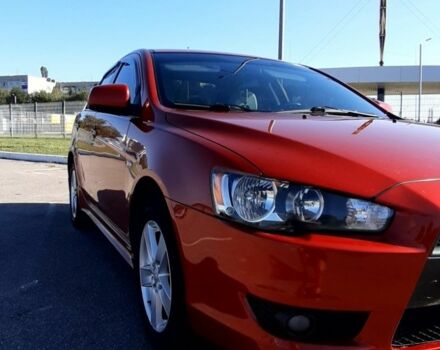 Красный Мицубиси Лансер, объемом двигателя 2 л и пробегом 110 тыс. км за 7500 $, фото 7 на Automoto.ua