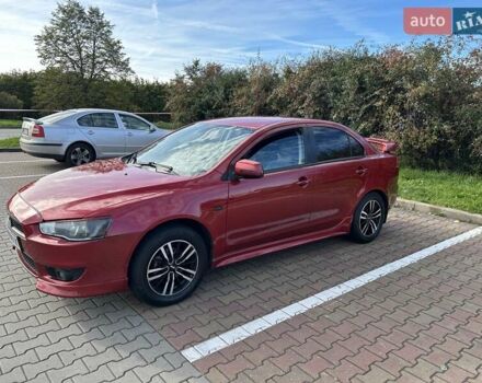 Красный Мицубиси Лансер, объемом двигателя 2 л и пробегом 227 тыс. км за 7000 $, фото 3 на Automoto.ua