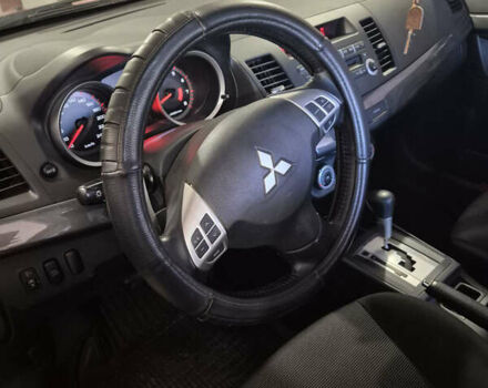 Красный Мицубиси Лансер, объемом двигателя 2 л и пробегом 65 тыс. км за 9300 $, фото 7 на Automoto.ua