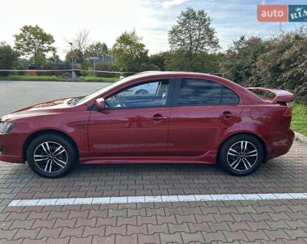 Красный Мицубиси Лансер, объемом двигателя 2 л и пробегом 227 тыс. км за 7000 $, фото 2 на Automoto.ua