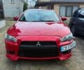 Красный Мицубиси Лансер, объемом двигателя 2 л и пробегом 267 тыс. км за 6000 $, фото 1 на Automoto.ua