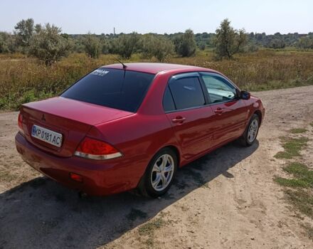 Червоний Міцубісі Lancer, об'ємом двигуна 1.6 л та пробігом 246 тис. км за 5500 $, фото 1 на Automoto.ua