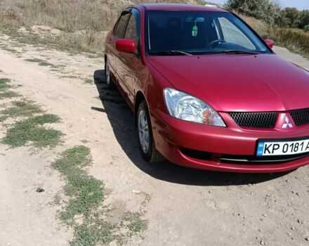 Червоний Міцубісі Lancer, об'ємом двигуна 1.6 л та пробігом 246 тис. км за 5500 $, фото 3 на Automoto.ua