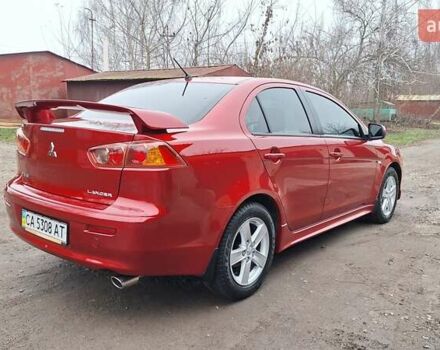 Красный Мицубиси Лансер, объемом двигателя 2 л и пробегом 120 тыс. км за 7800 $, фото 4 на Automoto.ua