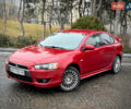 Красный Мицубиси Лансер, объемом двигателя 2 л и пробегом 196 тыс. км за 6450 $, фото 1 на Automoto.ua