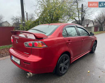 Красный Мицубиси Лансер, объемом двигателя 2 л и пробегом 246 тыс. км за 4900 $, фото 3 на Automoto.ua