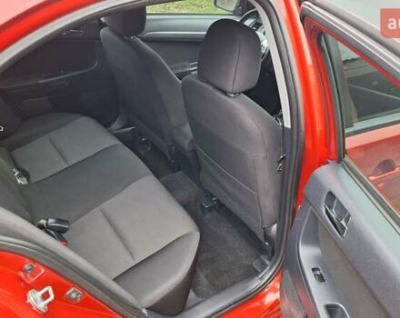 Красный Мицубиси Лансер, объемом двигателя 2 л и пробегом 120 тыс. км за 7800 $, фото 29 на Automoto.ua