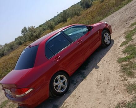 Червоний Міцубісі Lancer, об'ємом двигуна 1.6 л та пробігом 246 тис. км за 5500 $, фото 14 на Automoto.ua