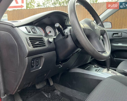 Міцубісі Lancer 2009 у Вінниці на Automoto.ua Червоний Міцубісі Lancer, об'ємом двигуна 1.58 л та пробігом 133 тис. км за 6750 $, фото 20 на Automoto.ua