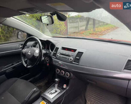 Красный Мицубиси Лансер, объемом двигателя 2 л и пробегом 246 тыс. км за 4900 $, фото 5 на Automoto.ua