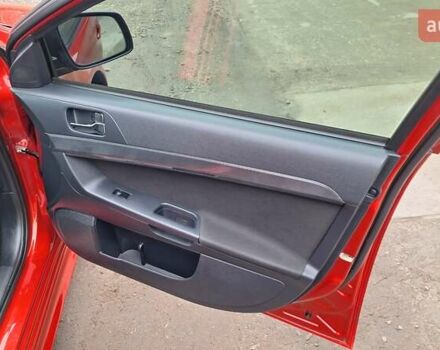 Красный Мицубиси Лансер, объемом двигателя 2 л и пробегом 120 тыс. км за 7800 $, фото 31 на Automoto.ua