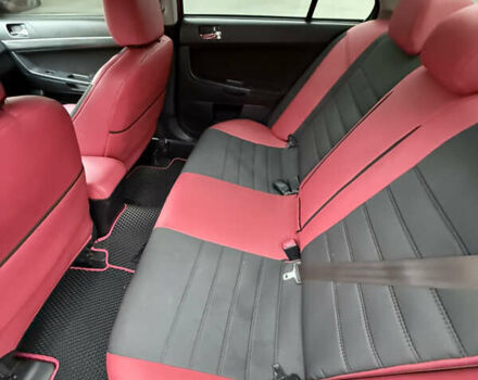 Красный Мицубиси Лансер, объемом двигателя 2 л и пробегом 170 тыс. км за 6300 $, фото 4 на Automoto.ua