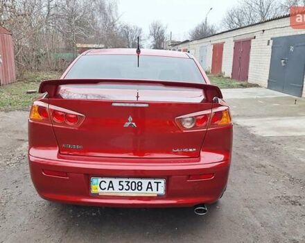 Красный Мицубиси Лансер, объемом двигателя 2 л и пробегом 120 тыс. км за 7800 $, фото 3 на Automoto.ua