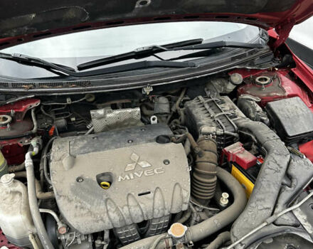 Красный Мицубиси Лансер, объемом двигателя 2 л и пробегом 92 тыс. км за 6500 $, фото 1 на Automoto.ua