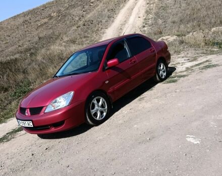 Червоний Міцубісі Lancer, об'ємом двигуна 1.6 л та пробігом 246 тис. км за 5500 $, фото 5 на Automoto.ua