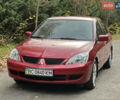 Міцубісі Lancer 2009 у Вінниці на Automoto.ua Червоний Міцубісі Lancer, об'ємом двигуна 1.58 л та пробігом 133 тис. км за 6750 $, фото 1 на Automoto.ua