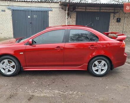 Красный Мицубиси Лансер, объемом двигателя 2 л и пробегом 120 тыс. км за 7800 $, фото 1 на Automoto.ua