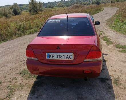 Червоний Міцубісі Lancer, об'ємом двигуна 1.6 л та пробігом 246 тис. км за 5500 $, фото 13 на Automoto.ua