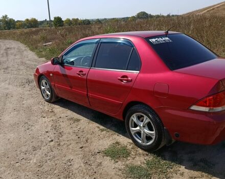 Червоний Міцубісі Lancer, об'ємом двигуна 1.6 л та пробігом 246 тис. км за 5500 $, фото 12 на Automoto.ua