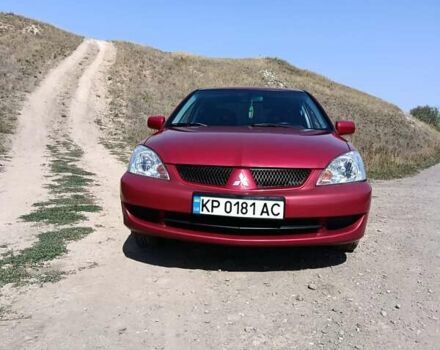 Червоний Міцубісі Lancer, об'ємом двигуна 1.6 л та пробігом 246 тис. км за 5500 $, фото 1 на Automoto.ua