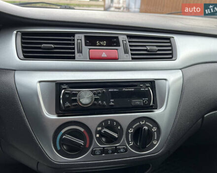 Міцубісі Lancer 2009 у Вінниці на Automoto.ua Червоний Міцубісі Lancer, об'ємом двигуна 1.58 л та пробігом 133 тис. км за 6750 $, фото 41 на Automoto.ua