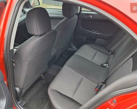 Красный Мицубиси Лансер, объемом двигателя 2 л и пробегом 120 тыс. км за 7800 $, фото 28 на Automoto.ua